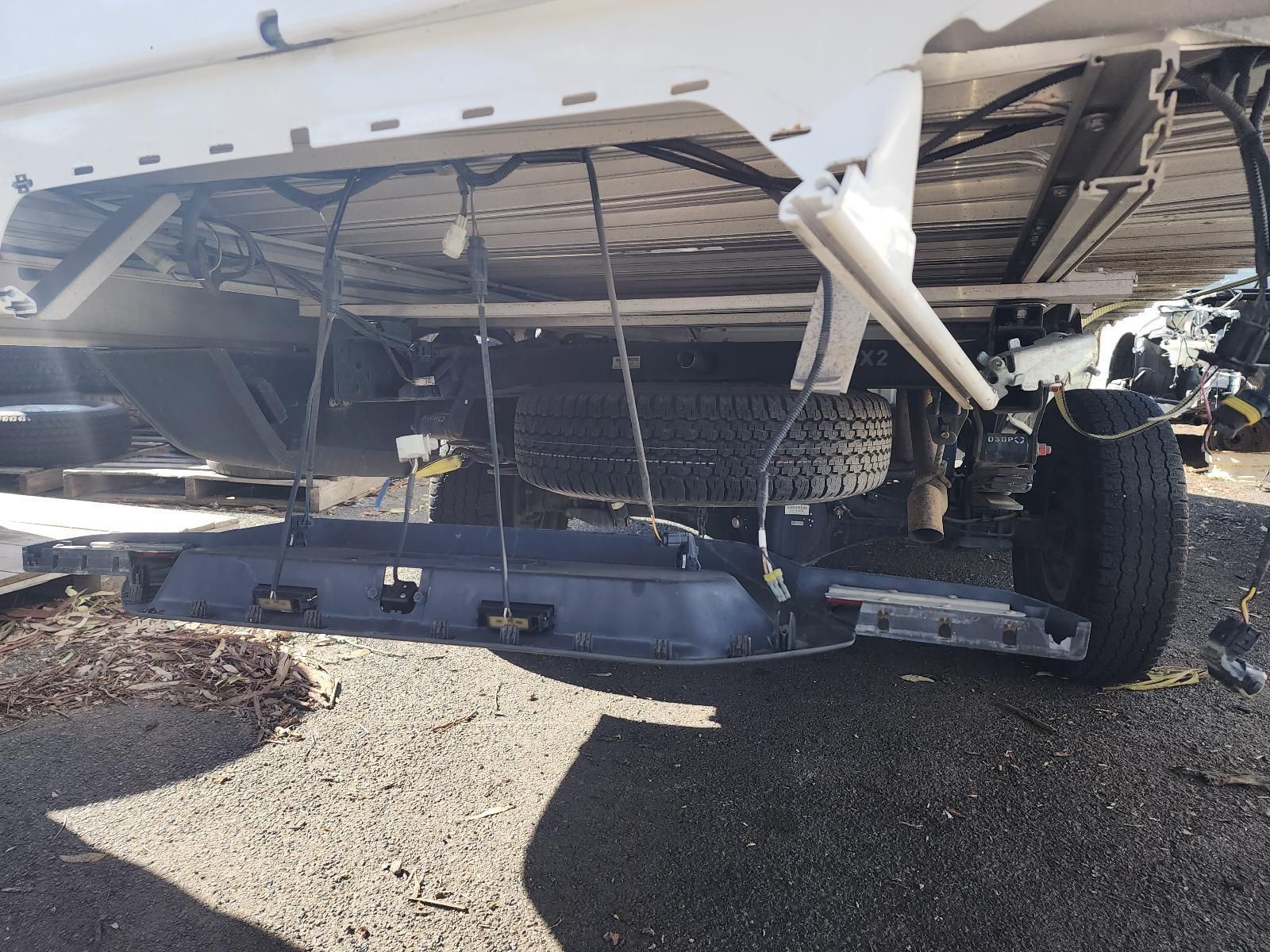 Undercarriage of a Damaged White Vehicle — South West 4WD Wreckers In Harristown, QLD