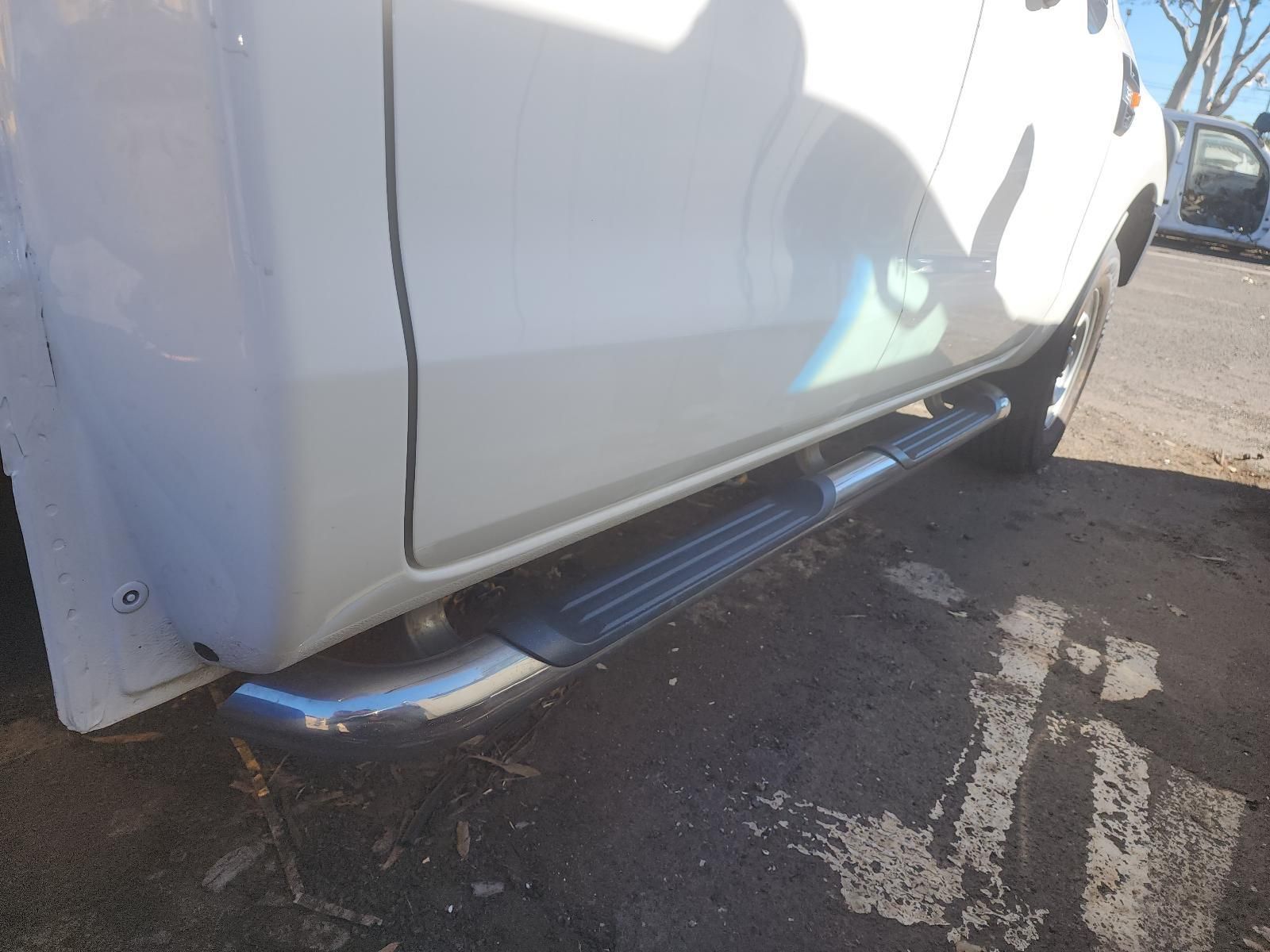 Close-up of a White Car’s Side Step — South West 4WD Wreckers In Harristown, QLD