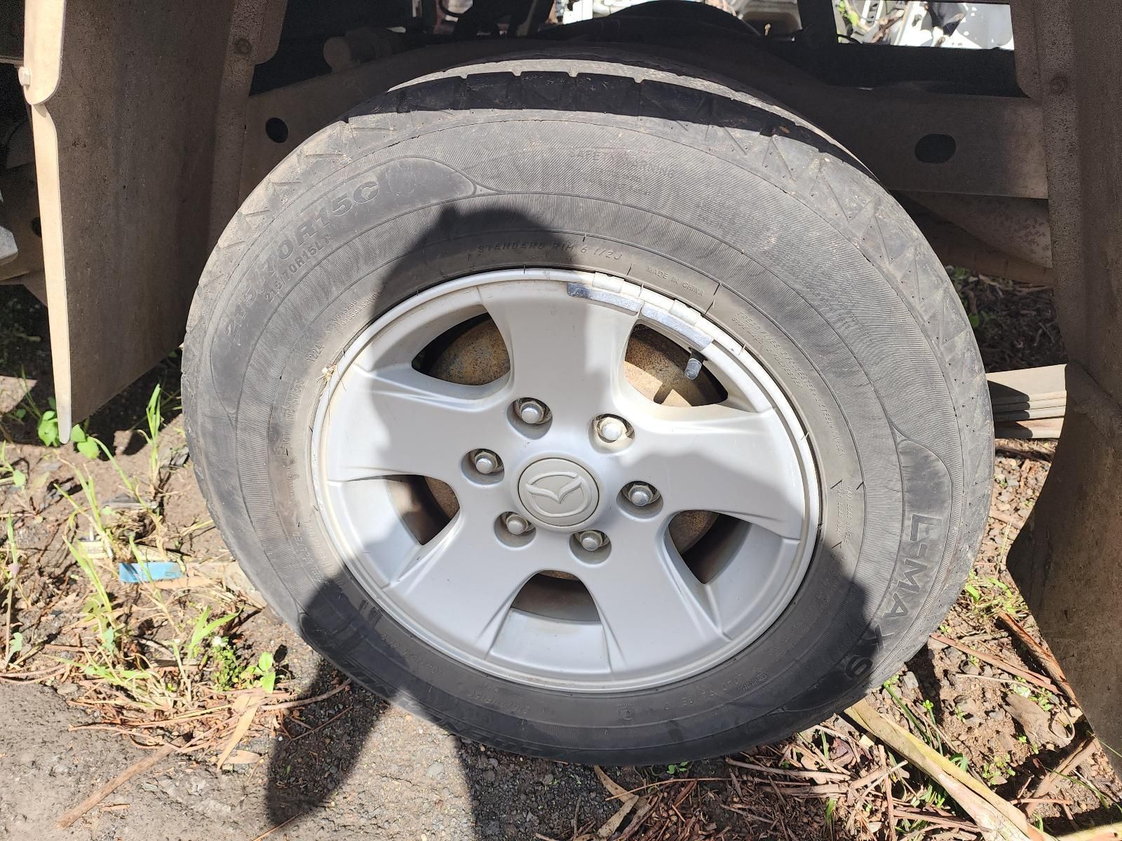 Flat Tire on a Silver Vehicle With a Black Sidewall — South West 4WD Wreckers In Harristown, QLD