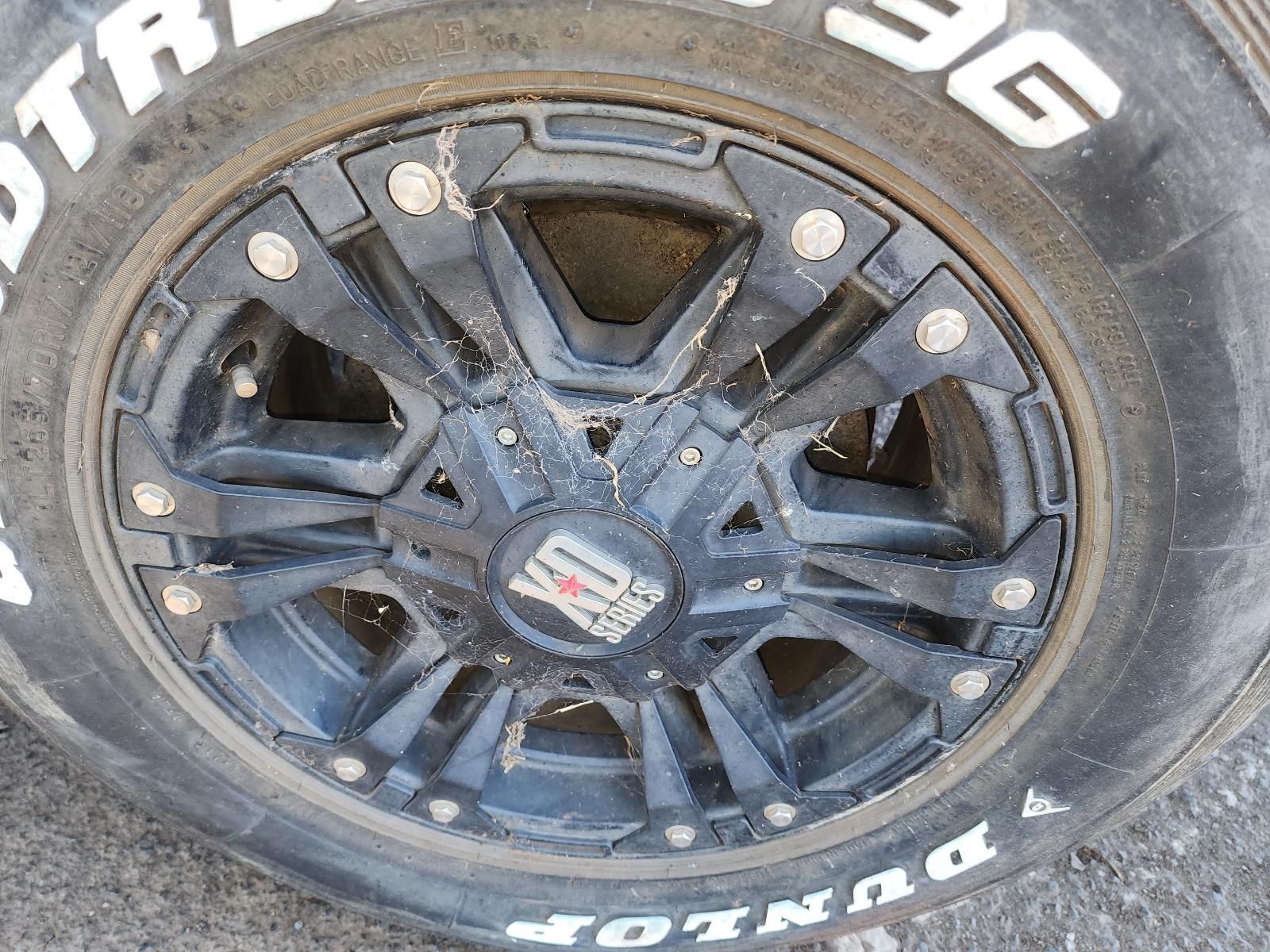 Close-up of a Black Off-road Truck Wheel — South West 4WD Wreckers In Harristown, QLD