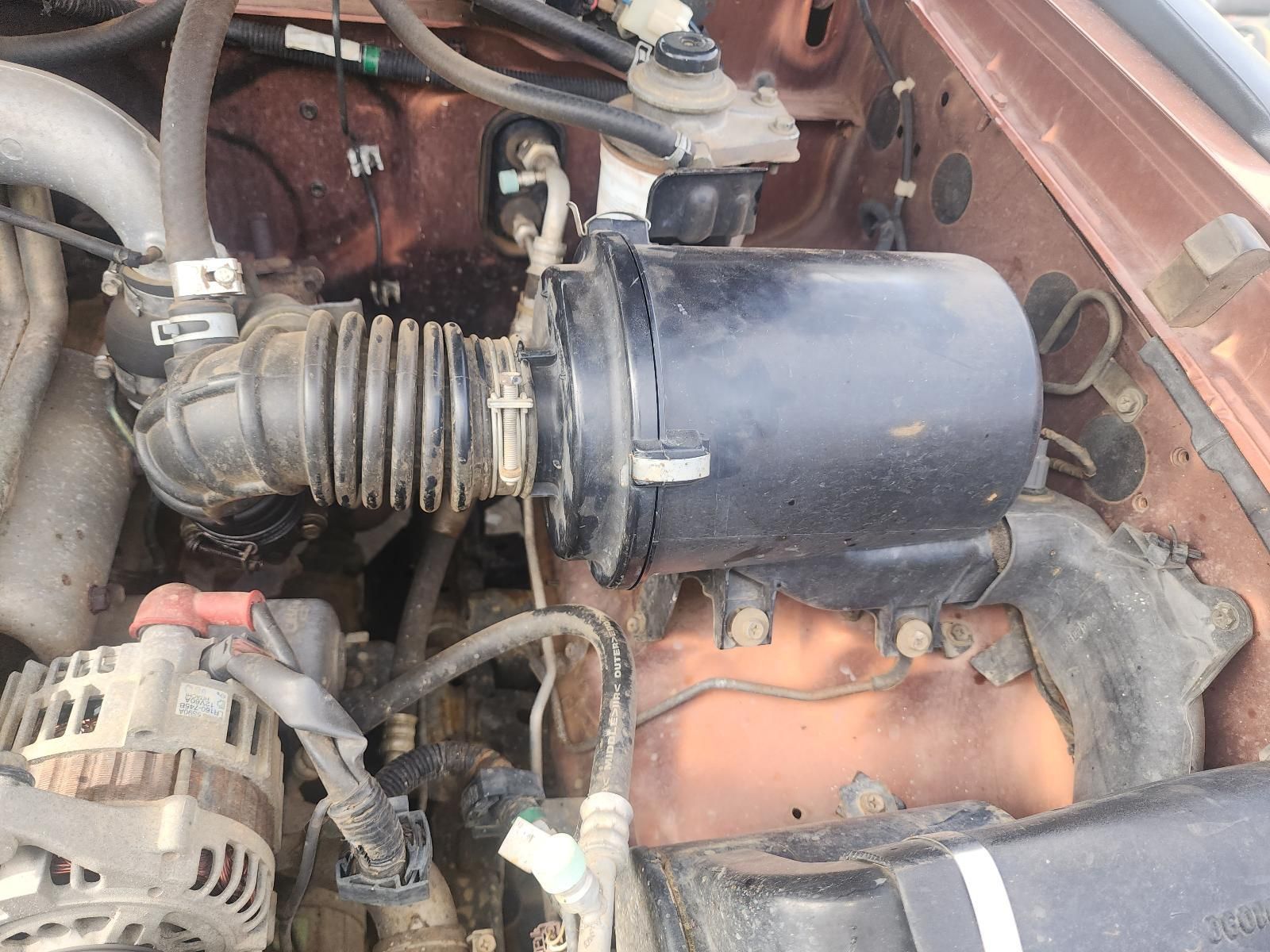 Open Car Engine Bay With Black Air Intake Hose — South West 4WD Wreckers In Harristown, QLD