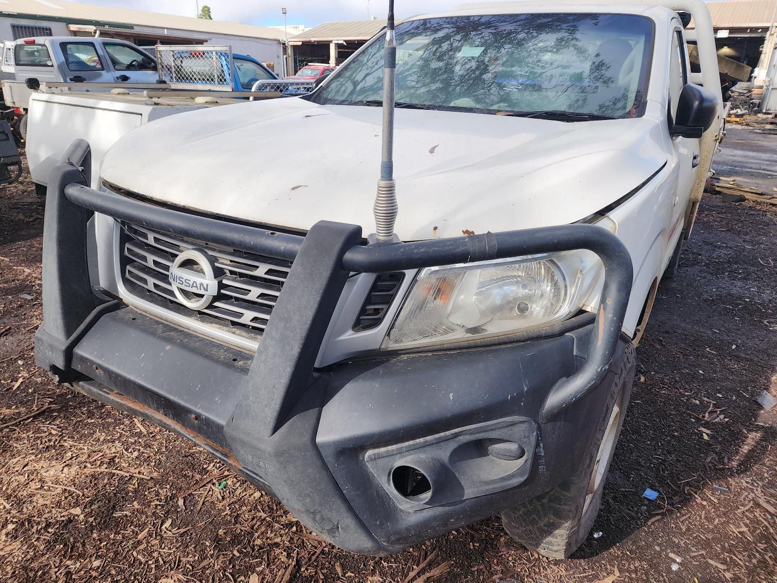 White Nissan Pickup With a Heavy-duty Front Grille Guard — South West 4WD Wreckers In Harristown, QLD