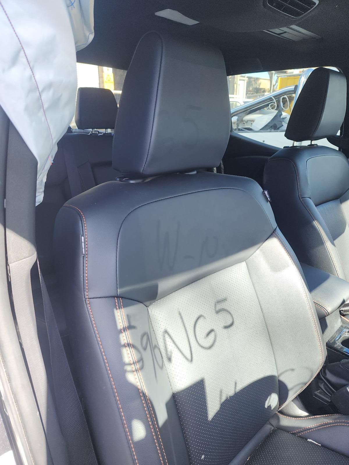 Inside a Car, Two Gray Seats Are Visible — South West 4WD Wreckers In Harristown, QLD