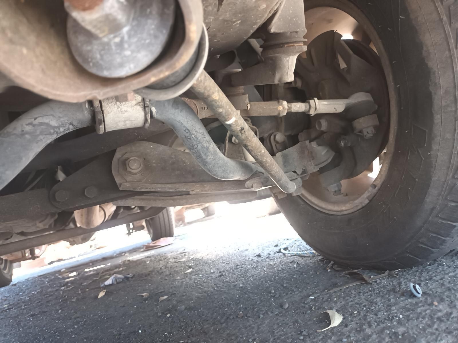 Close-Up of A Car’s Front Suspension and Wheel Underneath the Vehicle — South West 4WD Wreckers In Harristown, QLD