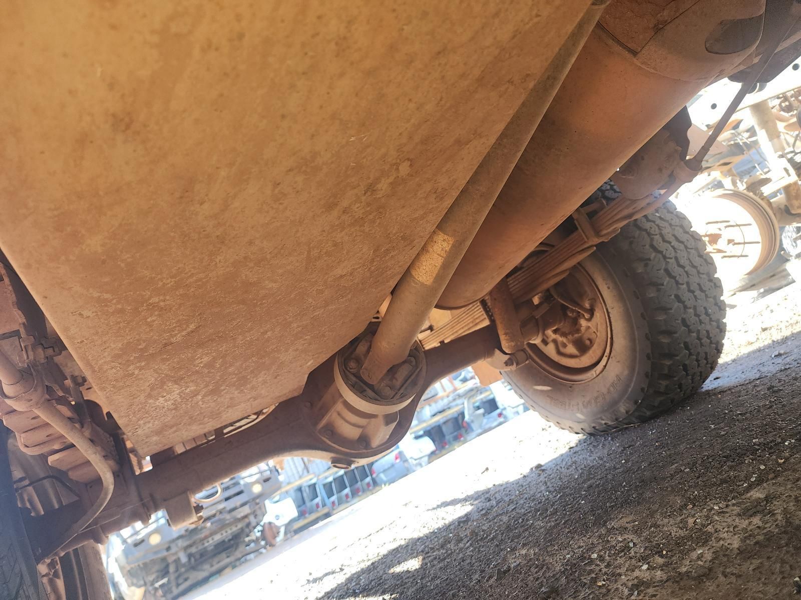 Undercarriage of a Dusty Off-road Vehicle — South West 4WD Wreckers In Harristown, QLD
