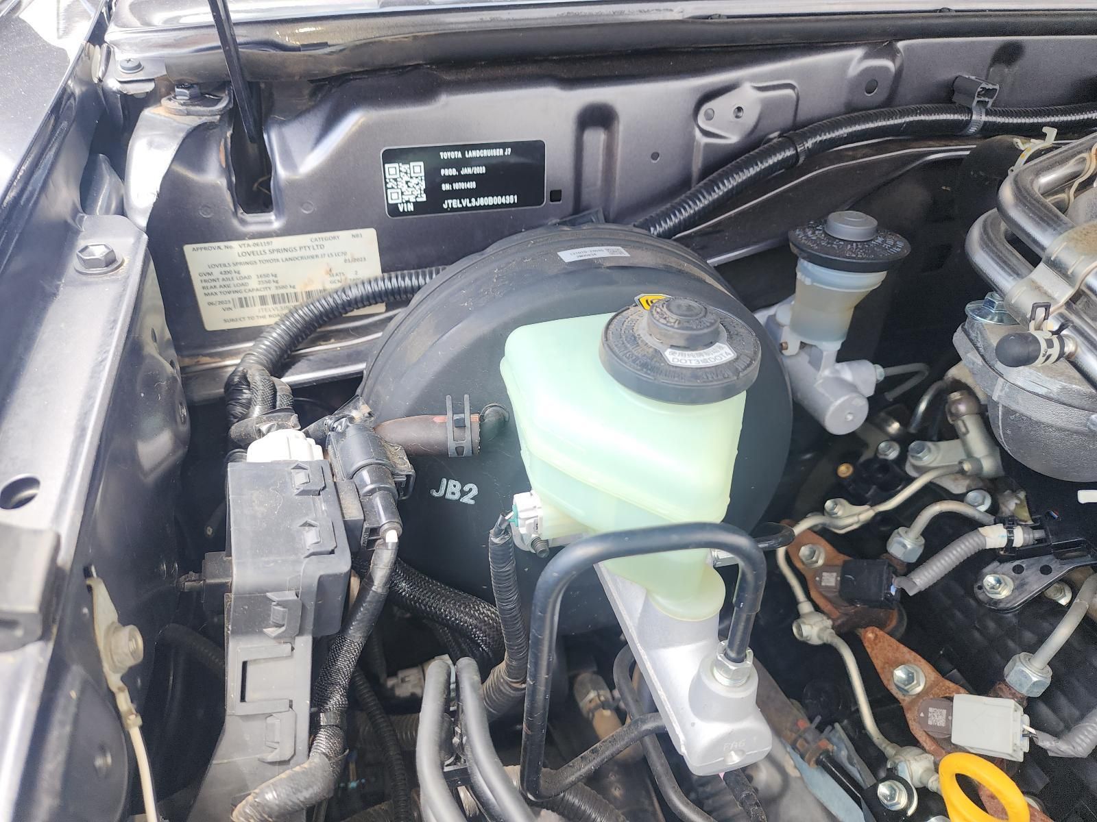 Car Engine Bay With Coolant Reservoir and Hoses — South West 4WD Wreckers In Harristown, QLD