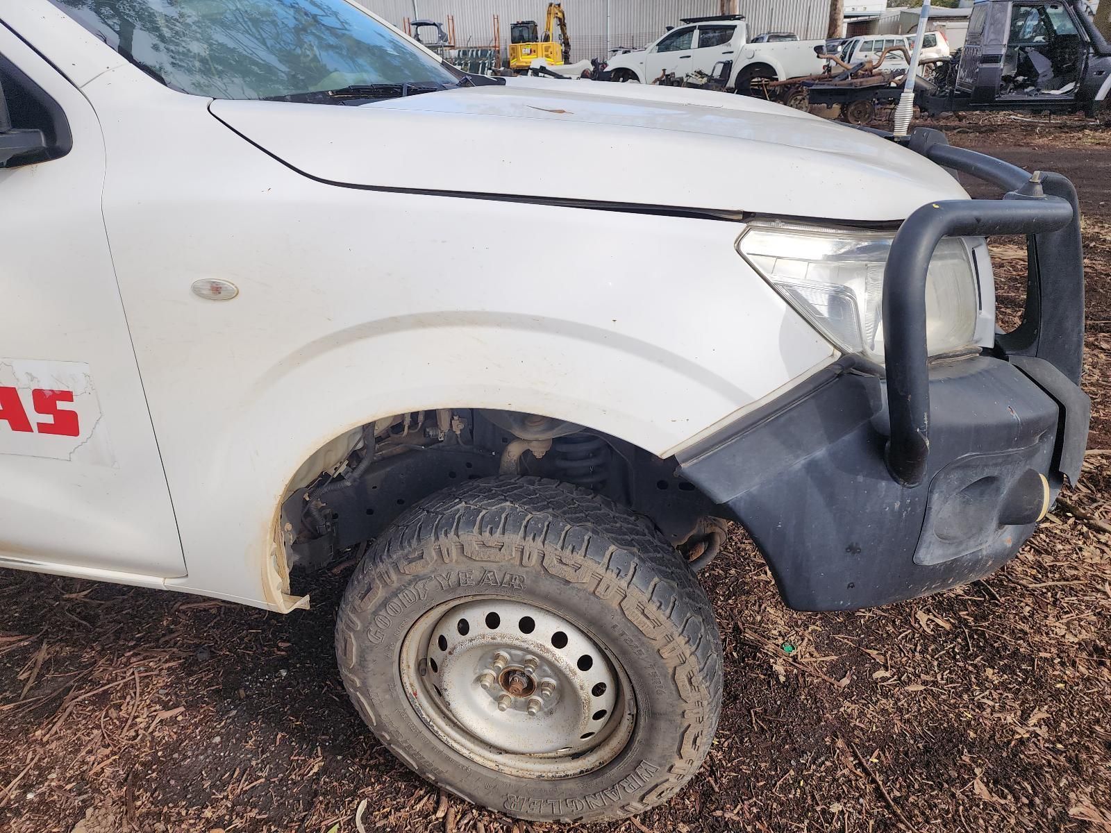 White Pickup Truck With Muddy Front Wheel — South West 4WD Wreckers In Harristown, QLD