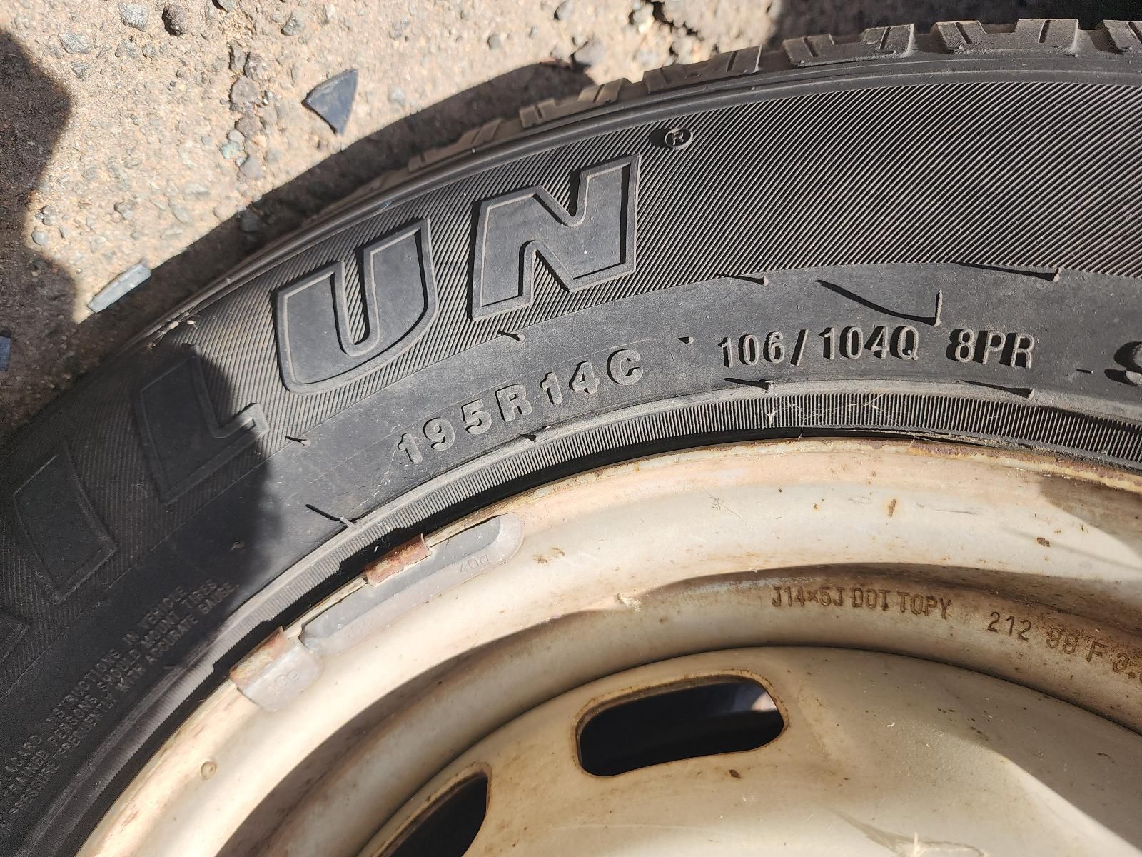 Close-up of a Worn Tire Sidewall on a Metal Rim — South West 4WD Wreckers In Harristown, QLD