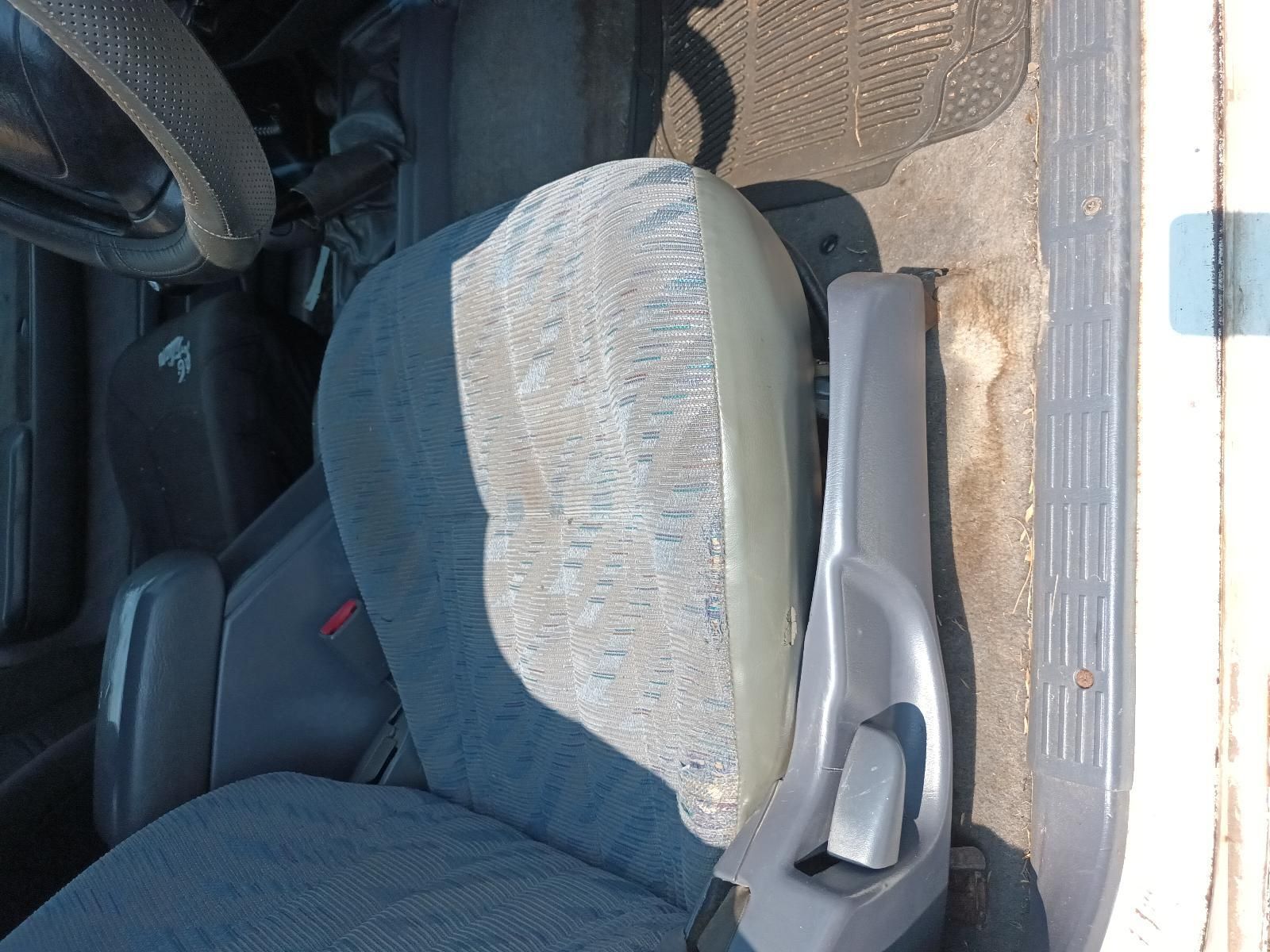 Blue Car Seat with A Grey Headrest and Armrest Near an Open Door — South West 4WD Wreckers In Harristown, QLD