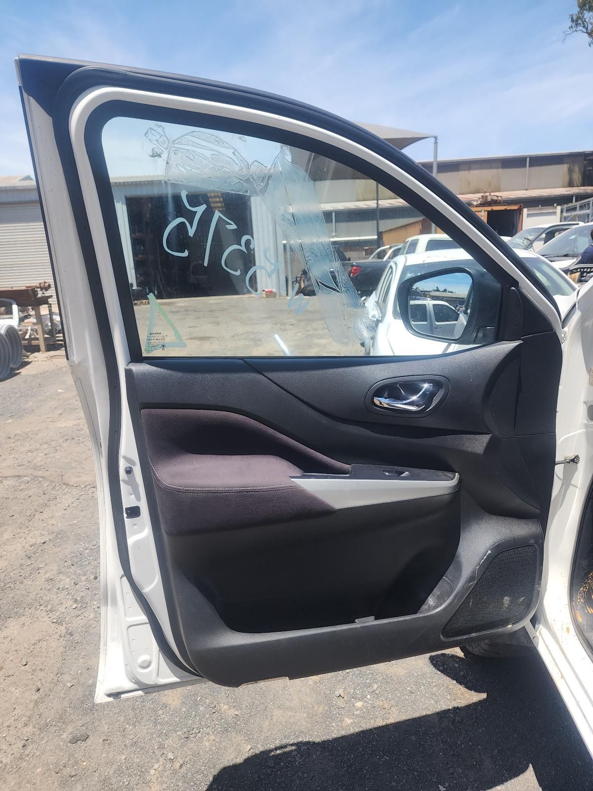 Open Car Door With Black Interior, Parked in a Dusty Lot — South West 4WD Wreckers In Harristown, QLD