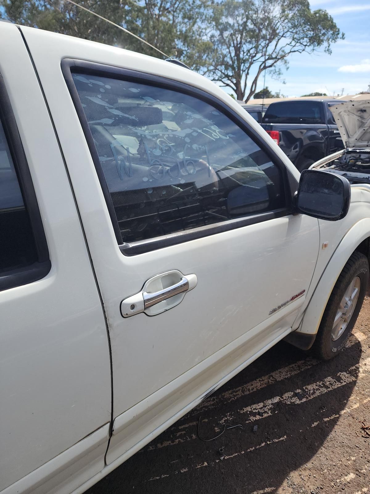 White Pickup Truck Parked Outdoors With a Black Side Mirror — South West 4WD Wreckers In Harristown, QLD