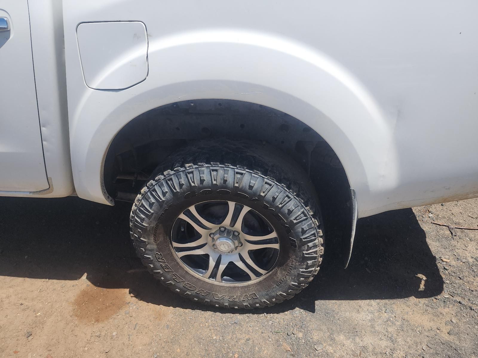 Close-up of a Silver Pickup Truck’s Rear Wheel — South West 4WD Wreckers In Harristown, QLD