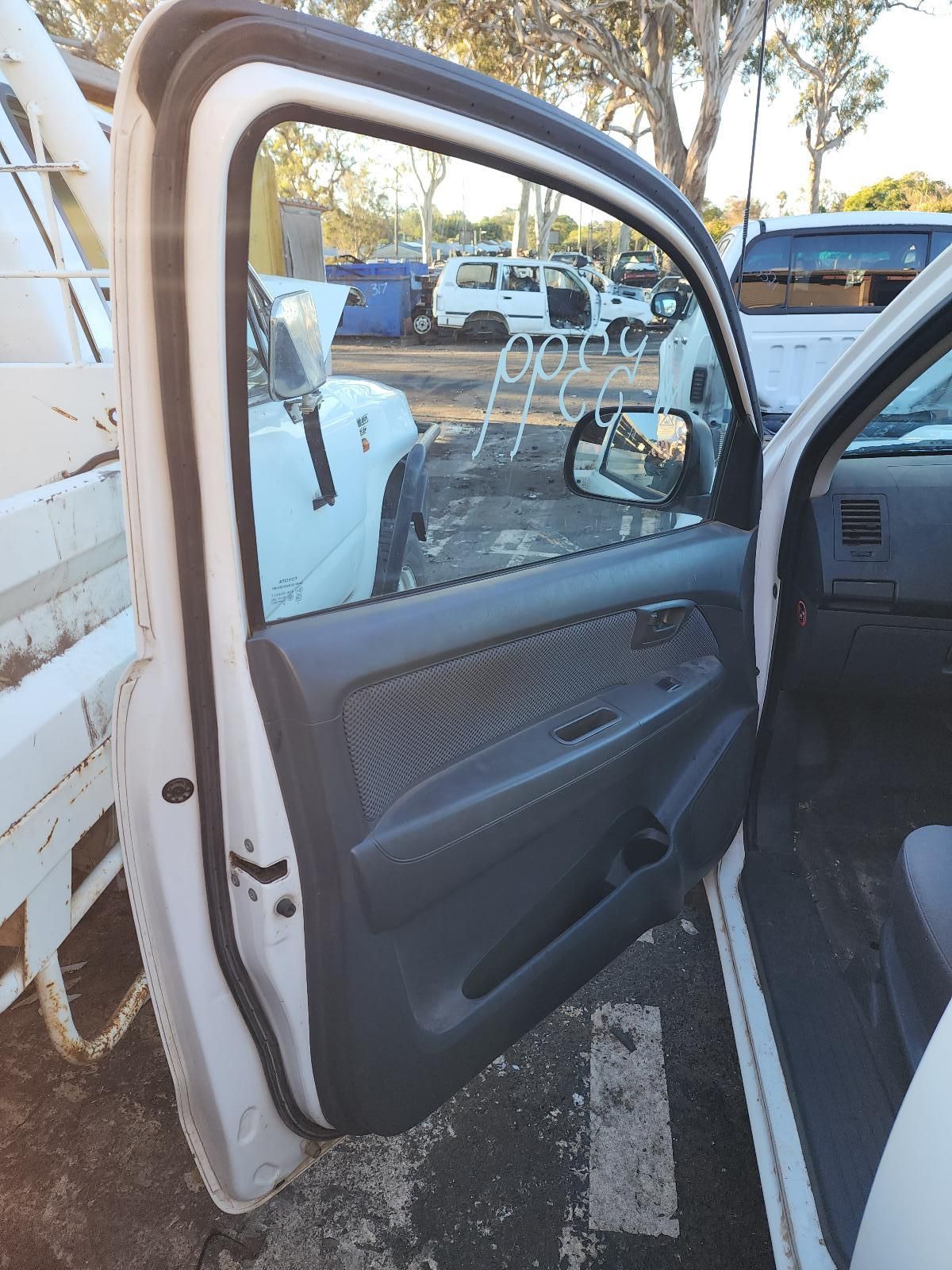 Open Car Door With Dark Interior Parked — South West 4WD Wreckers In Harristown, QLD