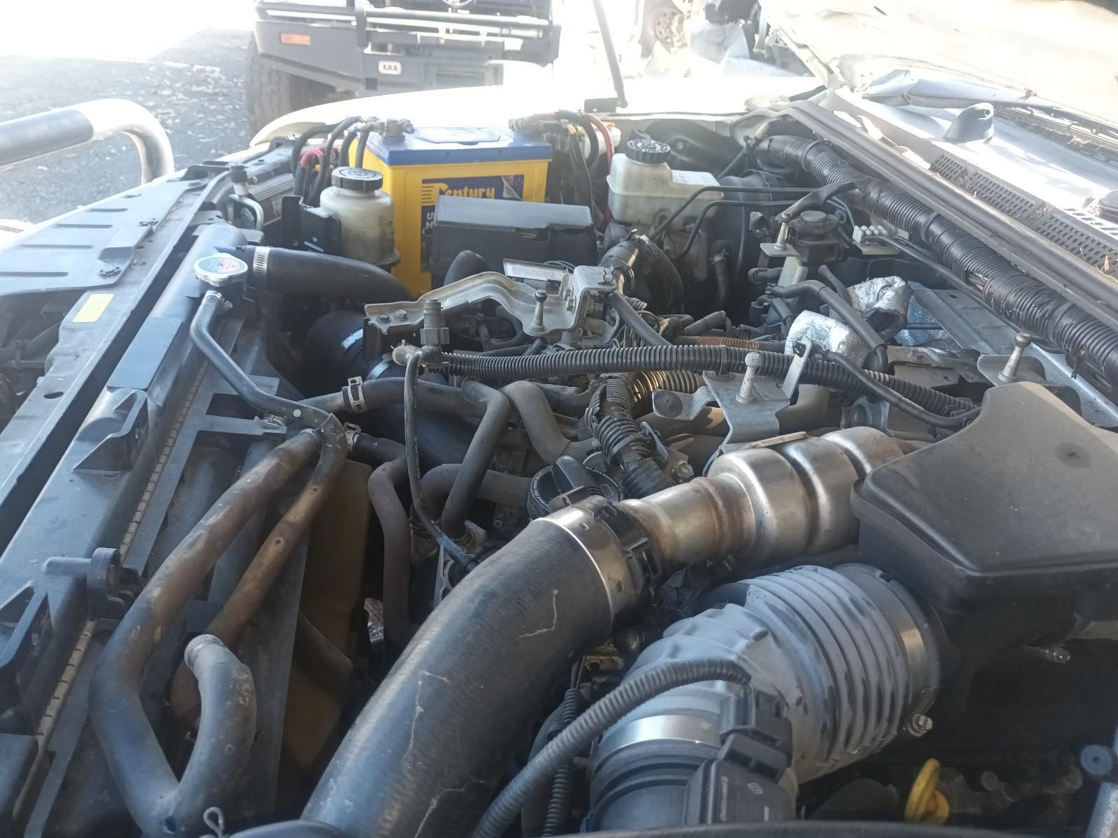 Open Truck Engine Bay with Hoses, Pipes, and Mechanical Components — South West 4WD Wreckers In Harristown, QLD