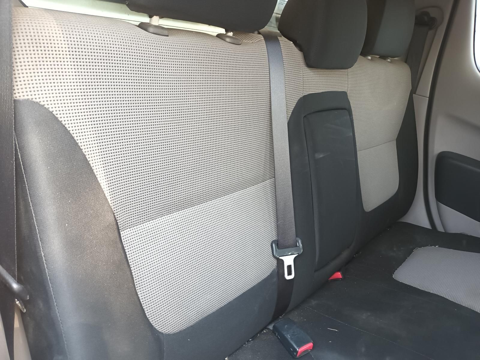 Car Back Seat with Black and Grey Patterned Upholstery and Seat Belts Visible — South West 4WD Wreckers In Harristown, QLD