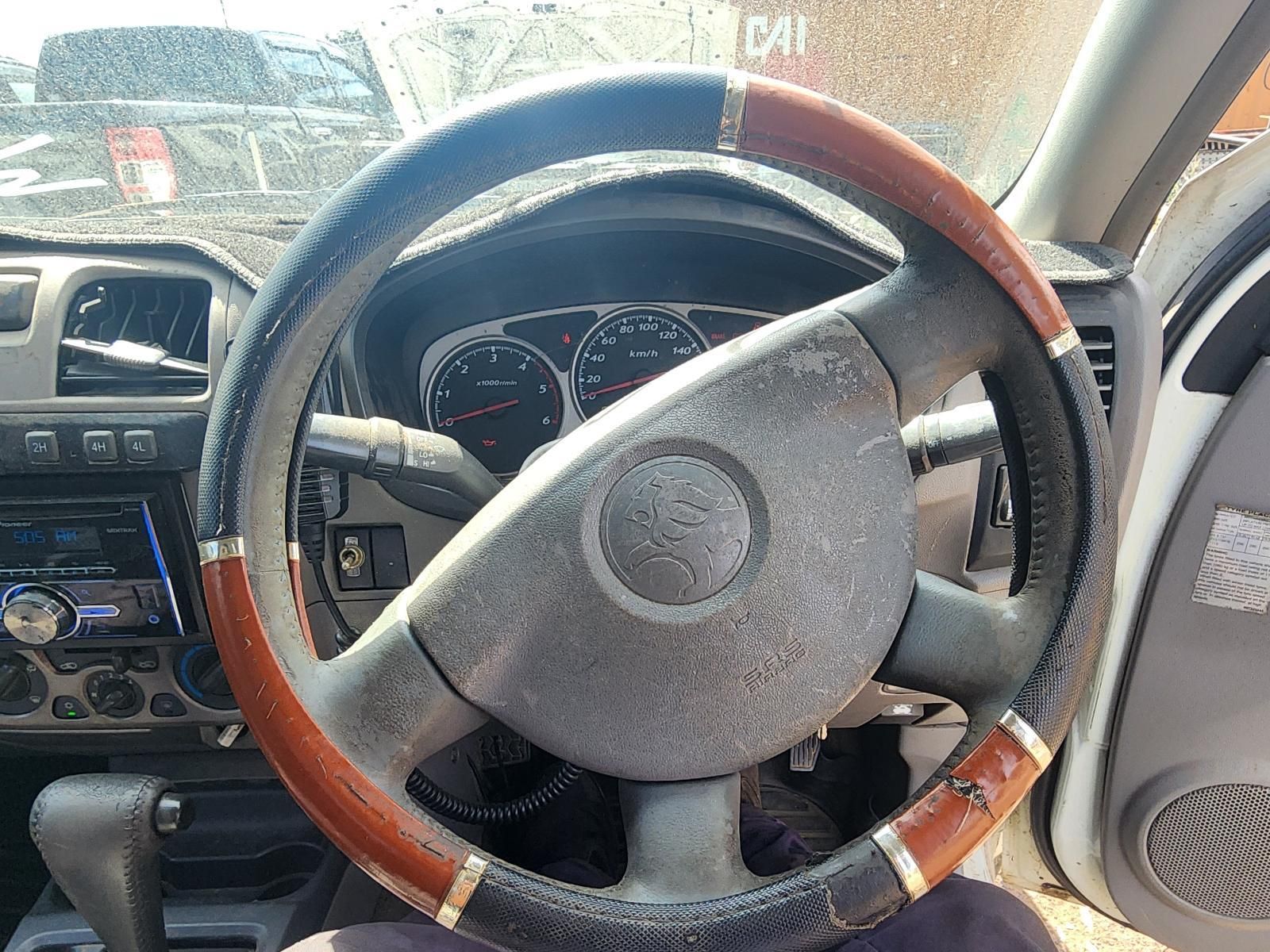Car Interior With a Wood-trimmed Steering Wheel — South West 4WD Wreckers In Harristown, QLD