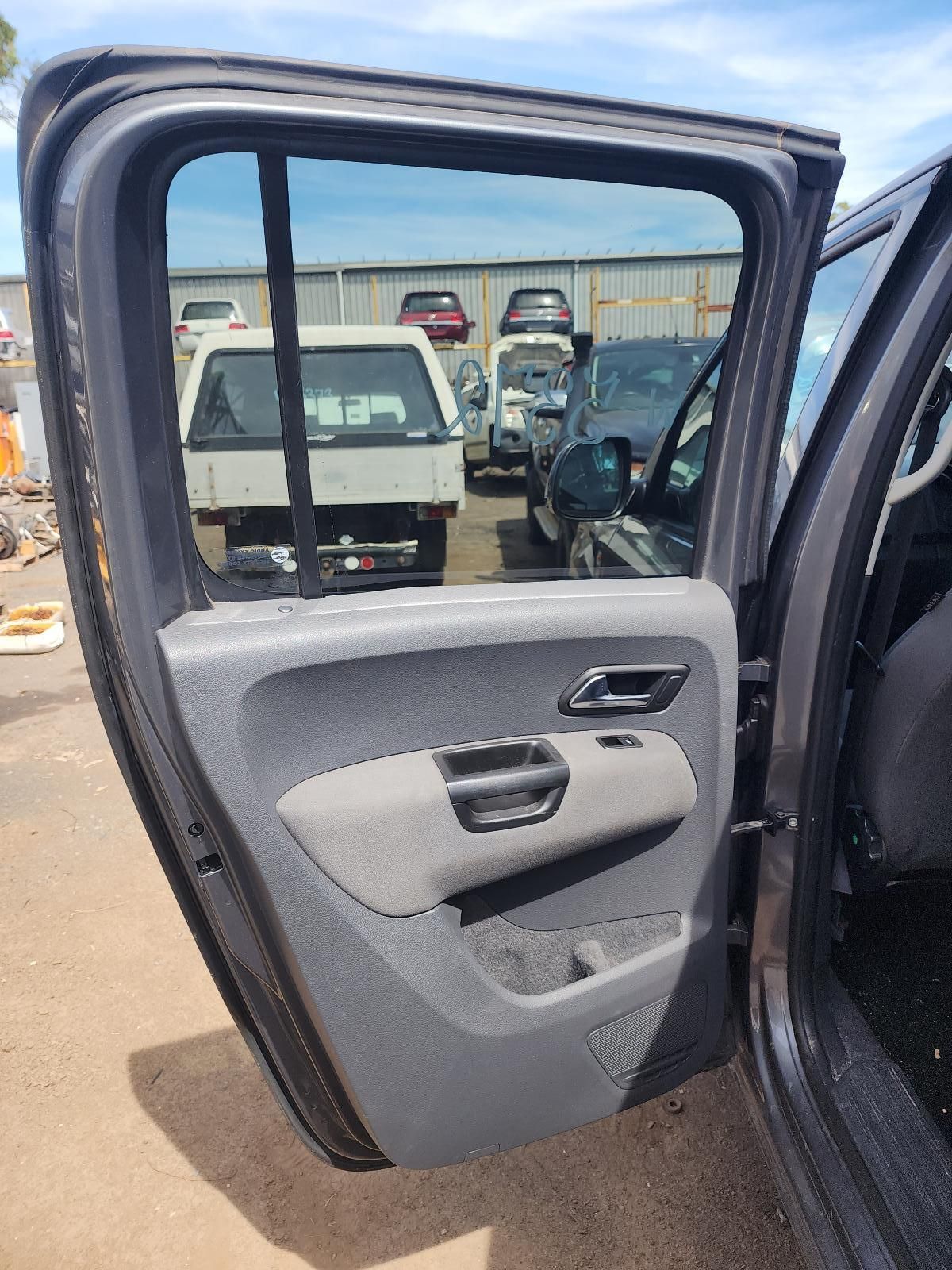 Open Car Door With Gray Interior Panel — South West 4WD Wreckers In Harristown, QLD