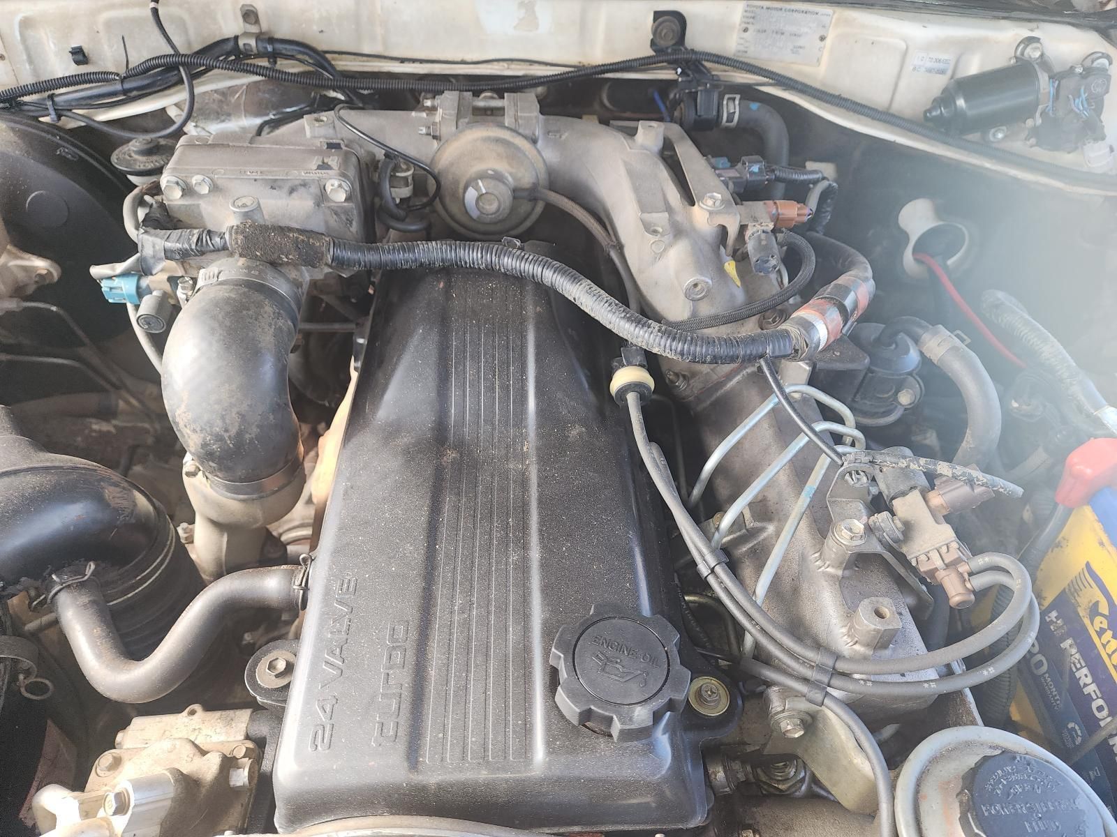 Car Engine Bay With Hoses — South West 4WD Wreckers In Harristown, QLD
