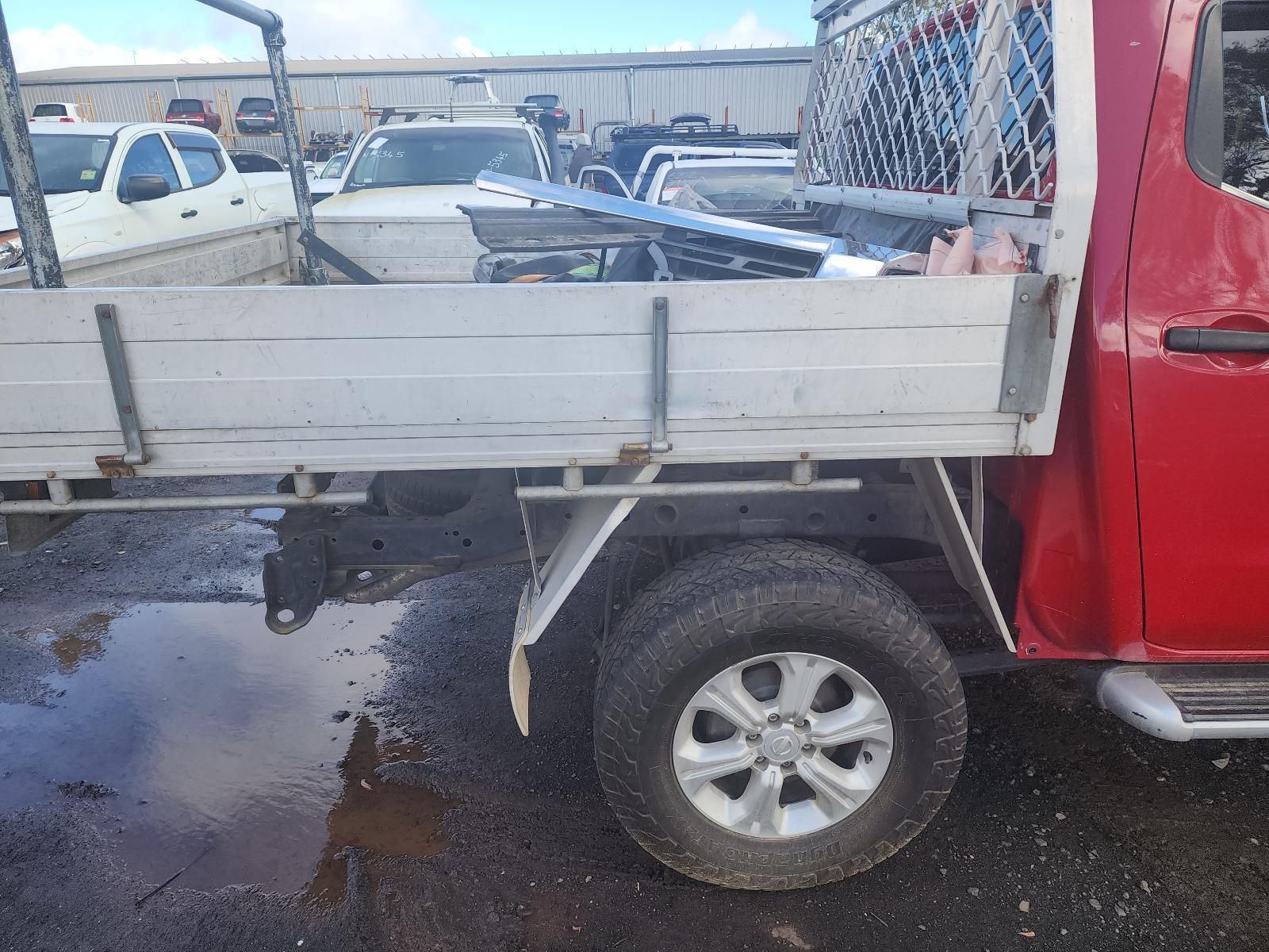 White Flatbed Truck With Red Cab Parked in a Lot — South West 4WD Wreckers In Harristown, QLD