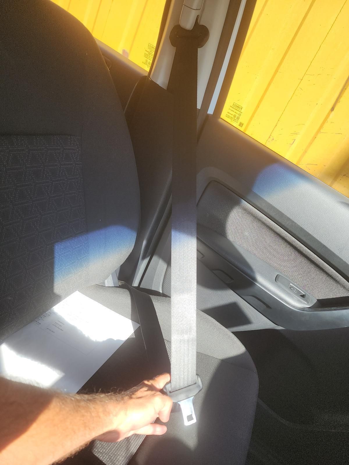 Hand Holding a Seat Belt Buckle — South West 4WD Wreckers In Harristown, QLD