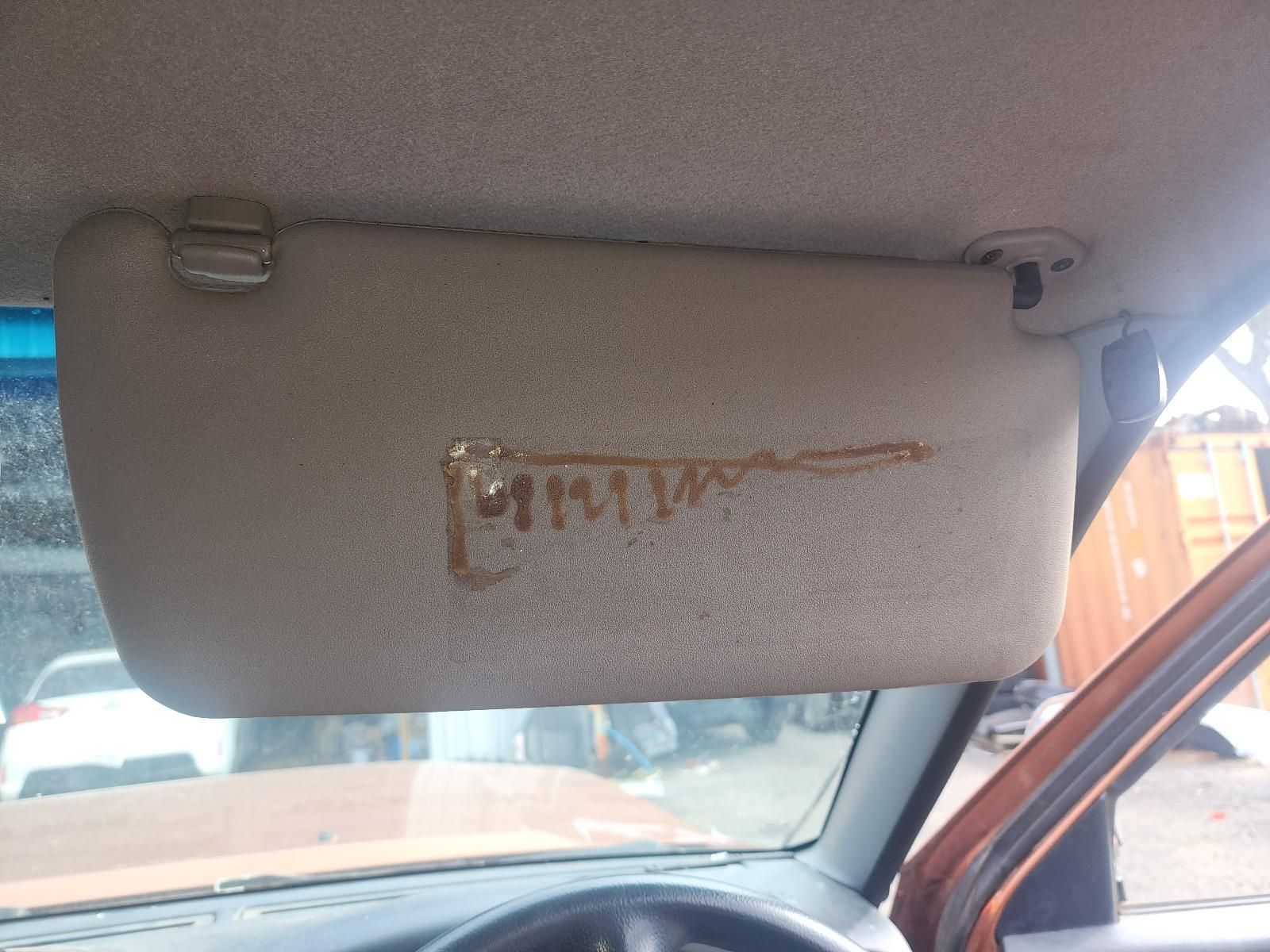 Car Sun Visor With a Gold Logo — South West 4WD Wreckers In Harristown, QLD