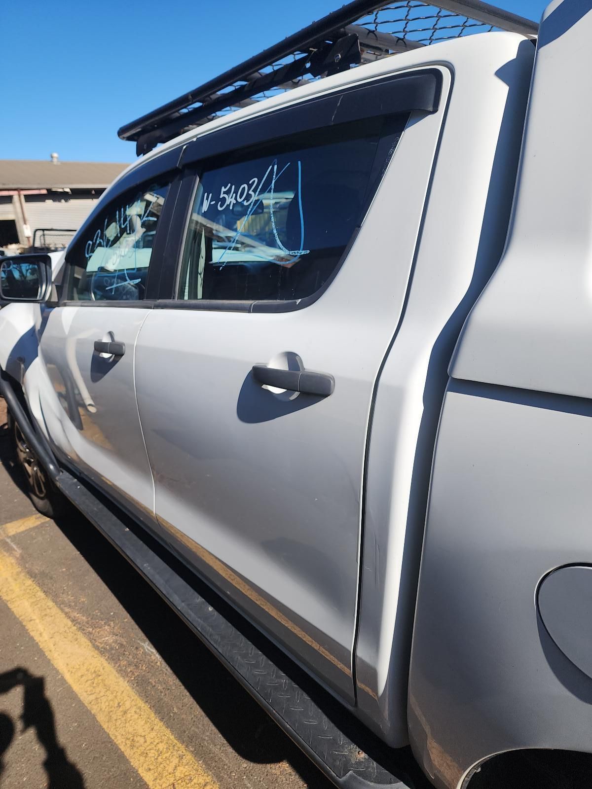 Silver Pickup Truck Parked in a Lot — South West 4WD Wreckers In Harristown, QLD