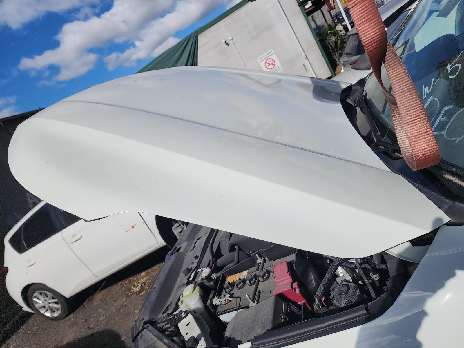 White Car With Hood Open in a Salvage Yard — South West 4WD Wreckers In Harristown, QLD