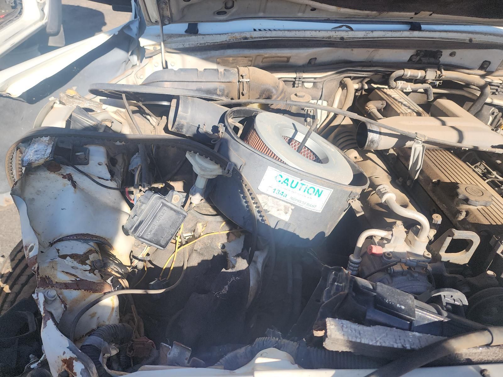 Car Engine Bay with A Damaged, Dusty Engine — South West 4WD Wreckers In Harristown, QLD