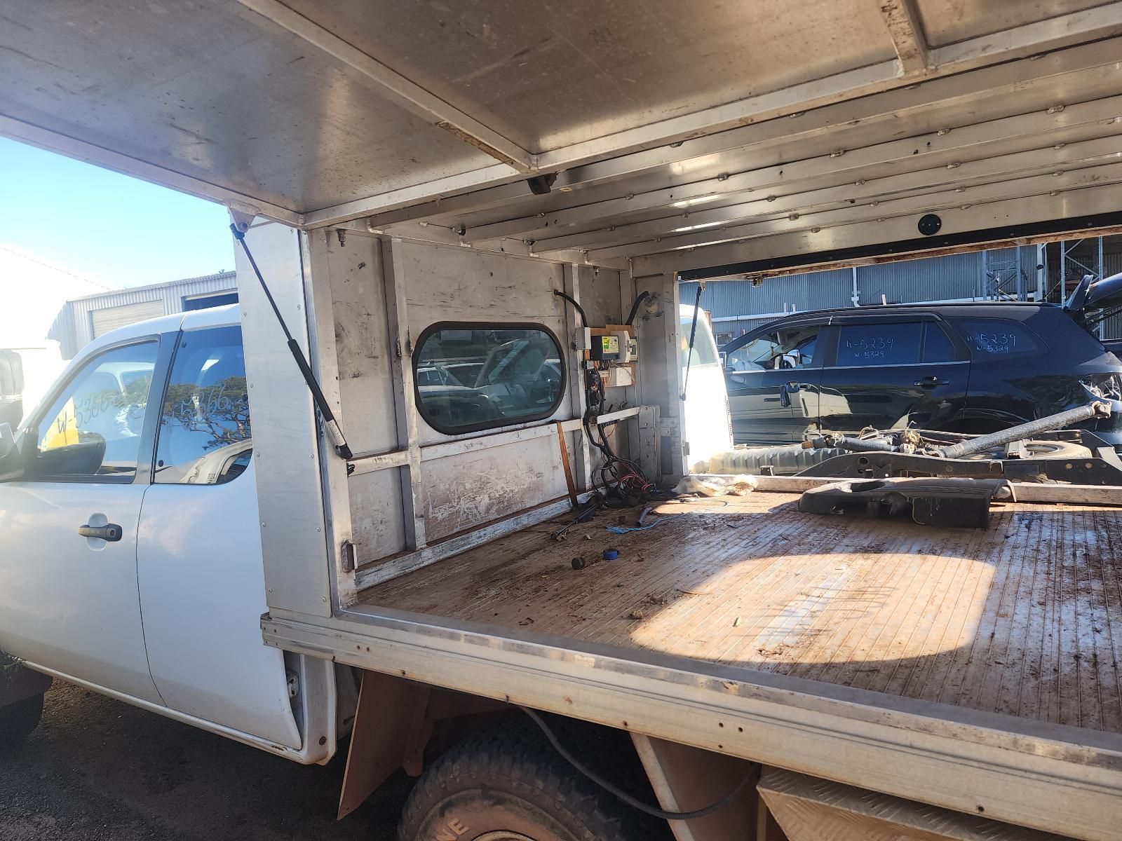 White Truck With an Open Cargo Bed — South West 4WD Wreckers In Harristown, QLD
