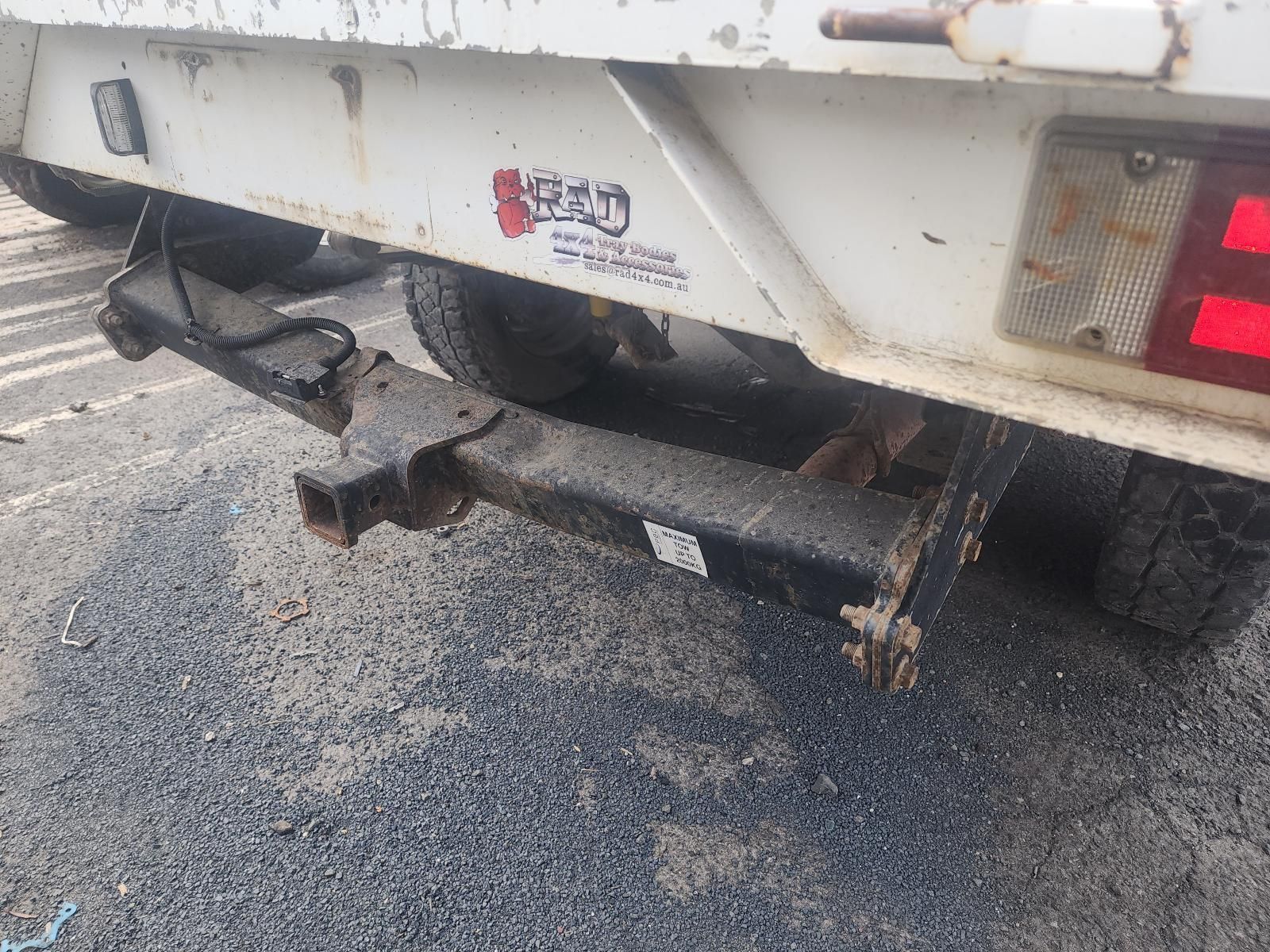 Rear View of a White Truck With a Damaged — South West 4WD Wreckers In Harristown, QLD