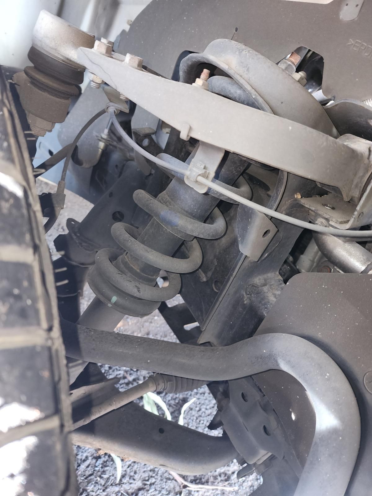 Close-up of a Vehicle Suspension Spring — South West 4WD Wreckers In Harristown, QLD