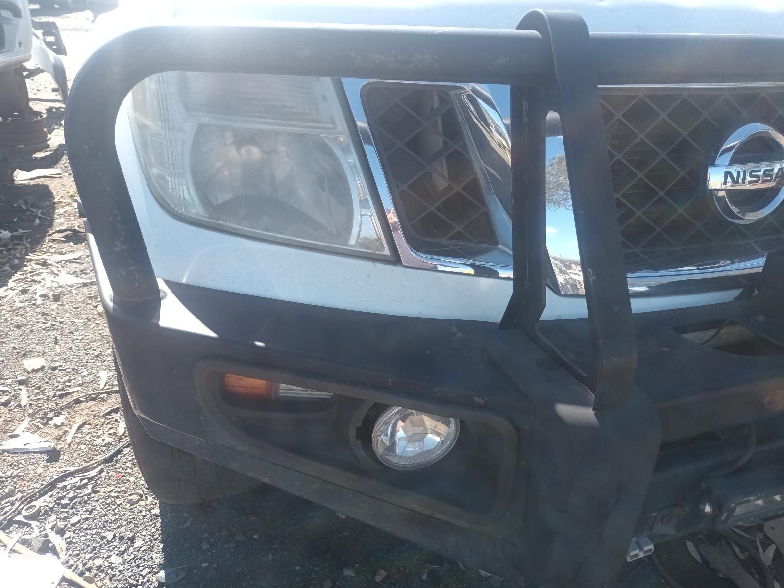 Close-Up of A Nissan Suv’s Front Grille and Headlight — South West 4WD Wreckers In Harristown, QLD