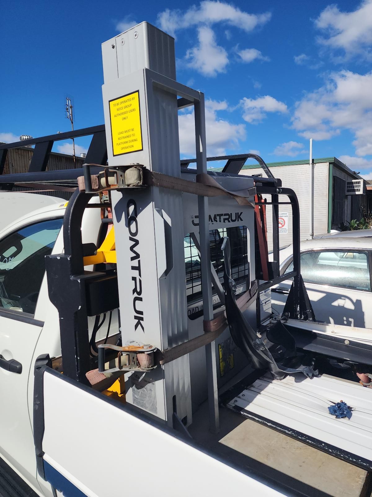 Vertical Forklift Mounted on a White Truck Bed — South West 4WD Wreckers In Harristown, QLD