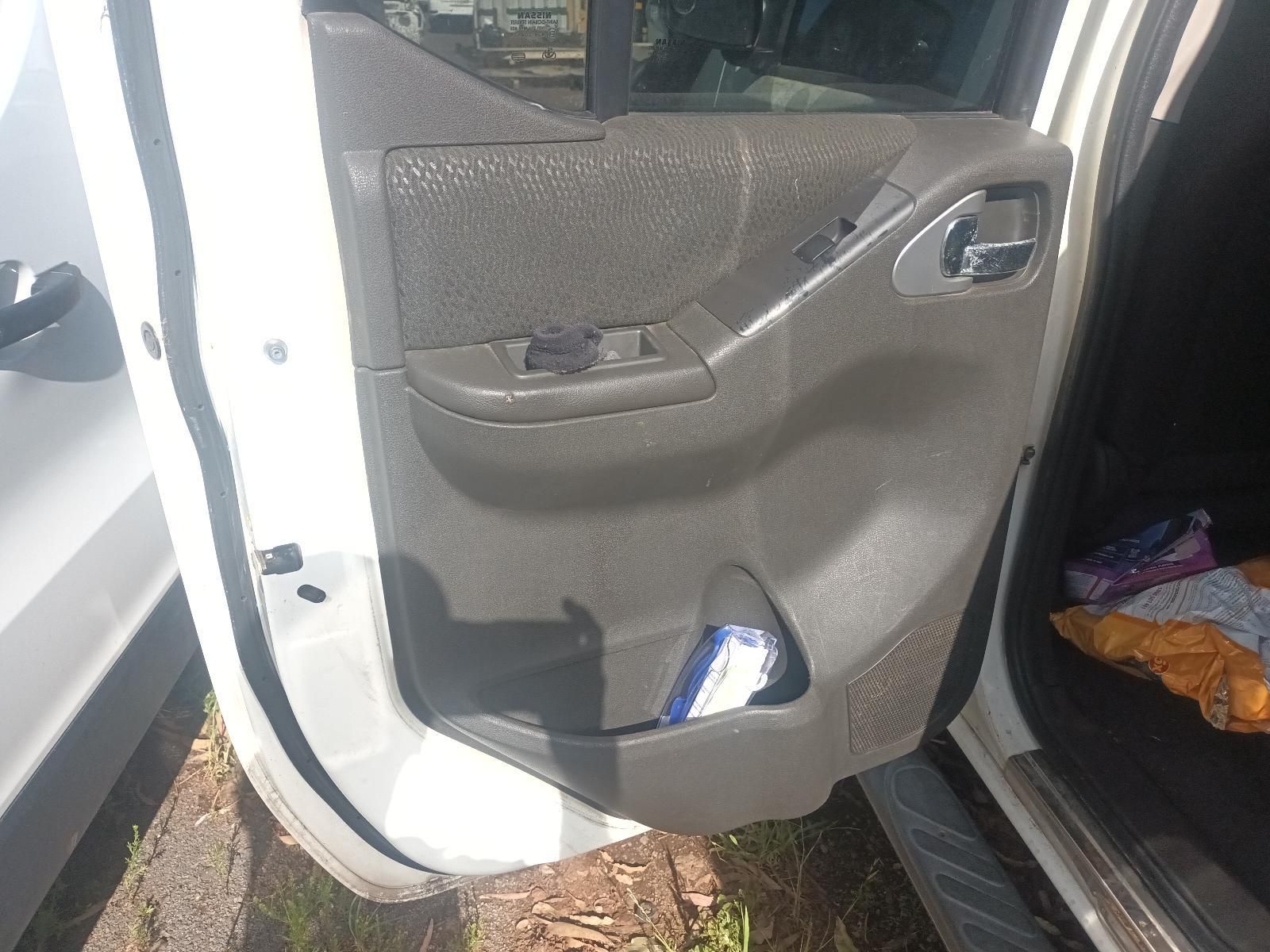 Open Car Door with Grey Interior Panel and A Small Bottle in The Door Pocket — South West 4WD Wreckers In Harristown, QLD