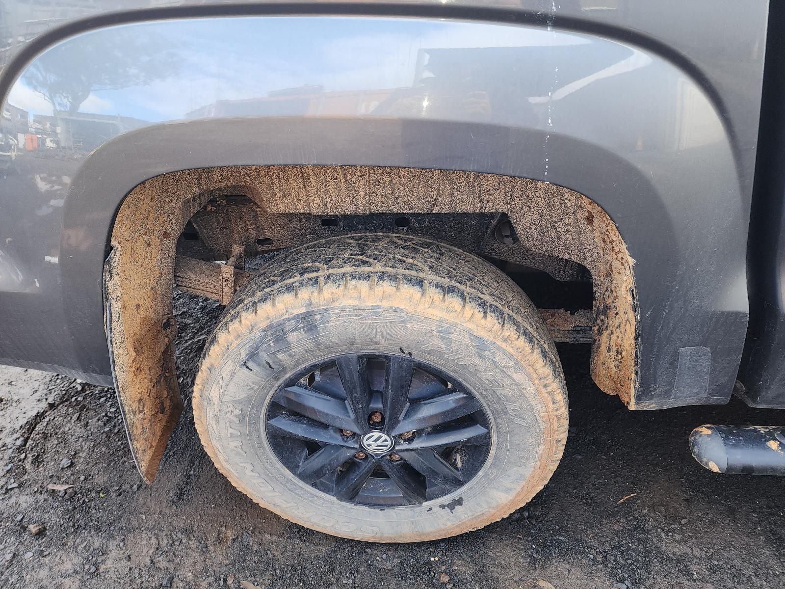 Close-up of a Muddy Car Rear Wheel — South West 4WD Wreckers In Harristown, QLD