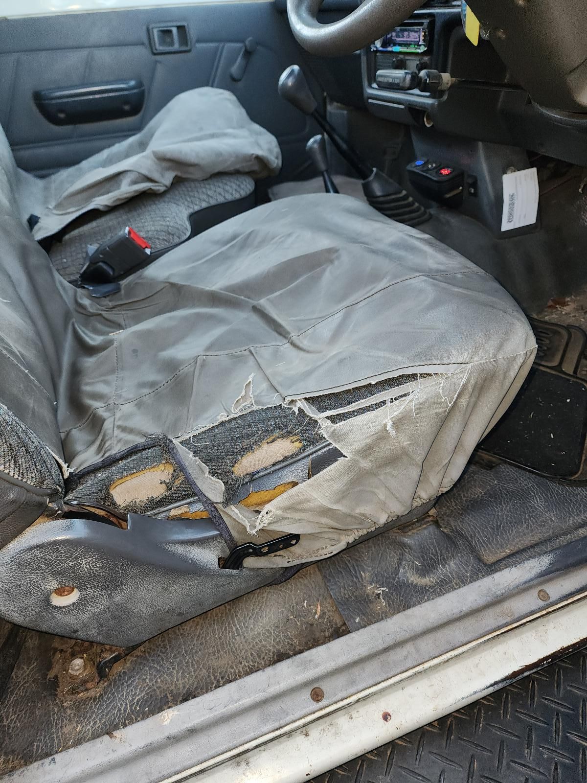 Damaged Gray Driver’s Seat — South West 4WD Wreckers In Harristown, QLD