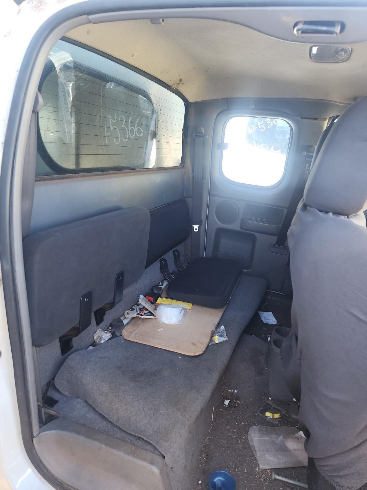 Car Interior With a Folded Back Seat Used as a Makeshift Bed — South West 4WD Wreckers In Harristown, QLD