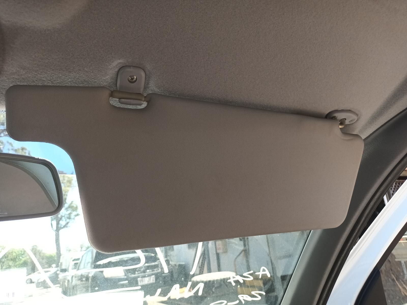 Beige Car Sun Visor Lowered Inside a Vehicle — South West 4WD Wreckers In Harristown, QLD