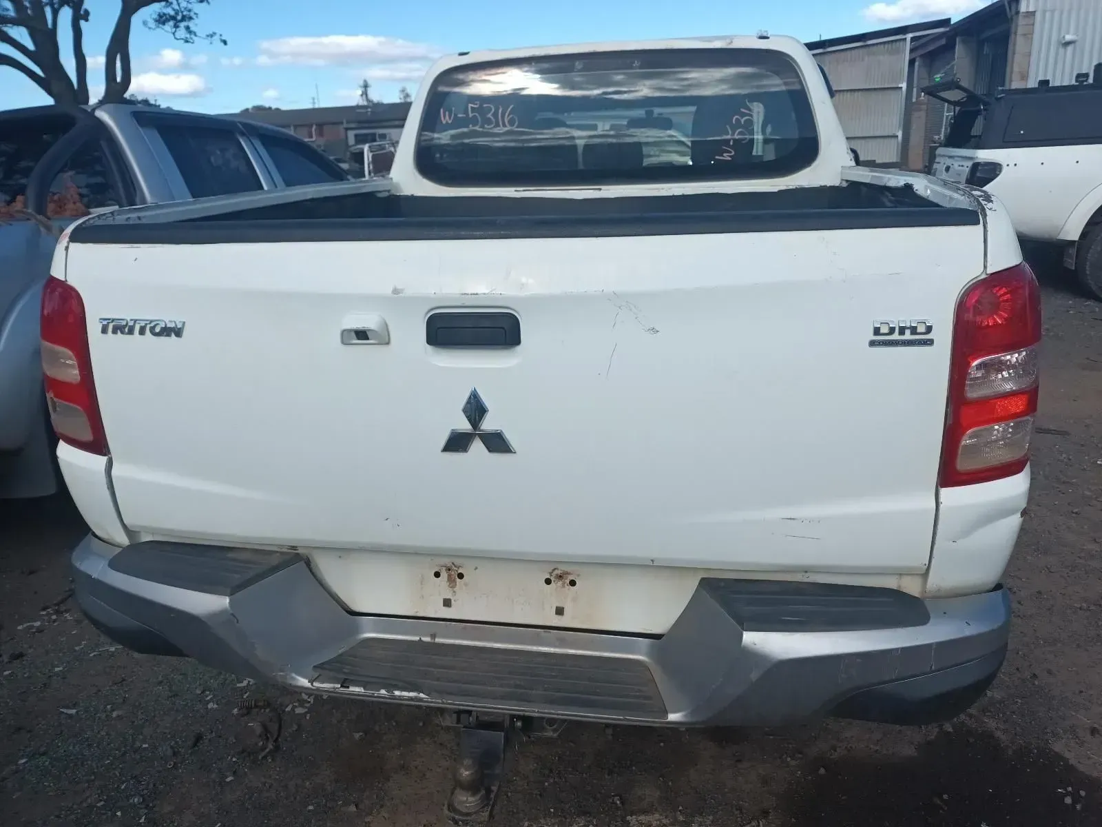 White Mitsubishi Triton Pickup Truck, Rear View — South West 4WD Wreckers In Harristown, QLD