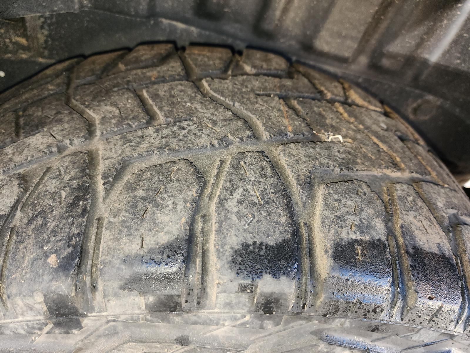 Close-up of a Dusty, Worn Vehicle Tire — South West 4WD Wreckers In Harristown, QLD