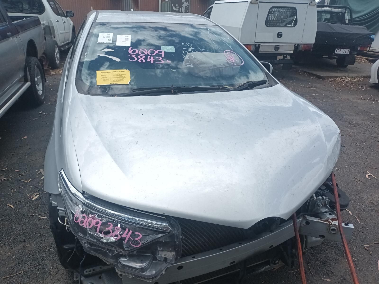 Damaged Silver Car Parked in A Lot — South West 4WD Wreckers In Harristown, QLD