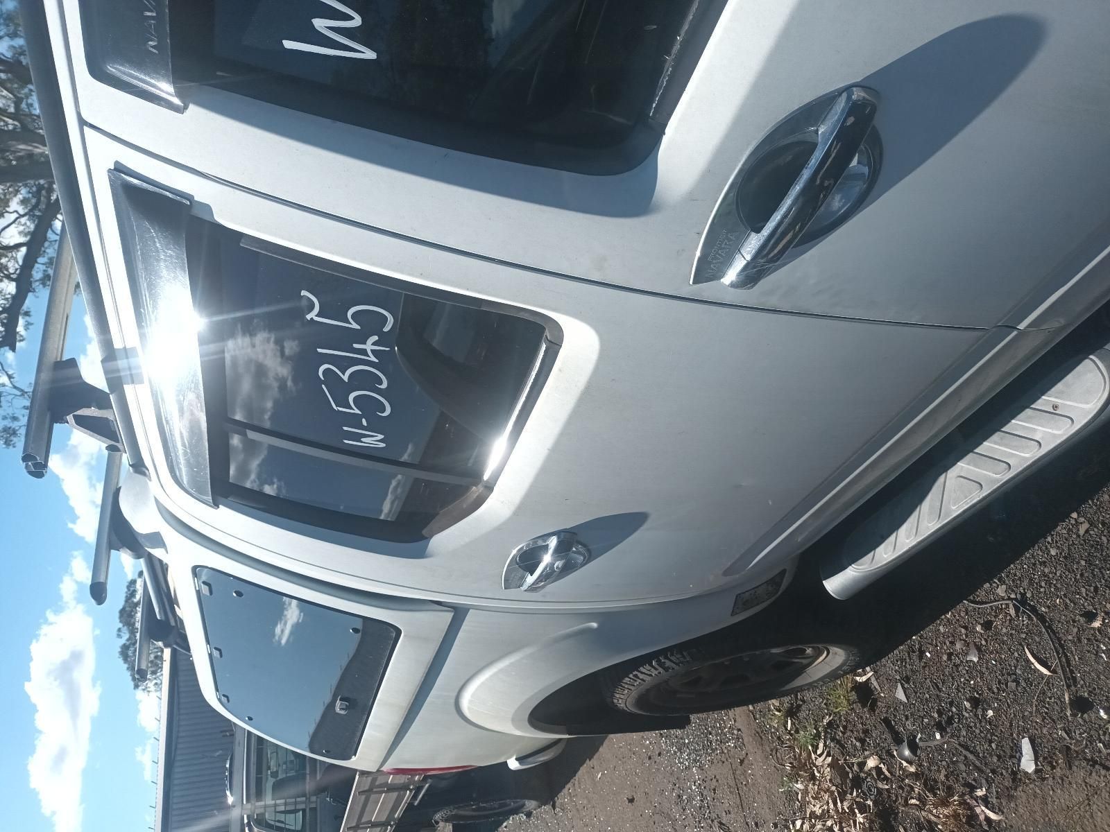 White Compact Suv Parked on A Sunny Street — South West 4WD Wreckers In Harristown, QLD