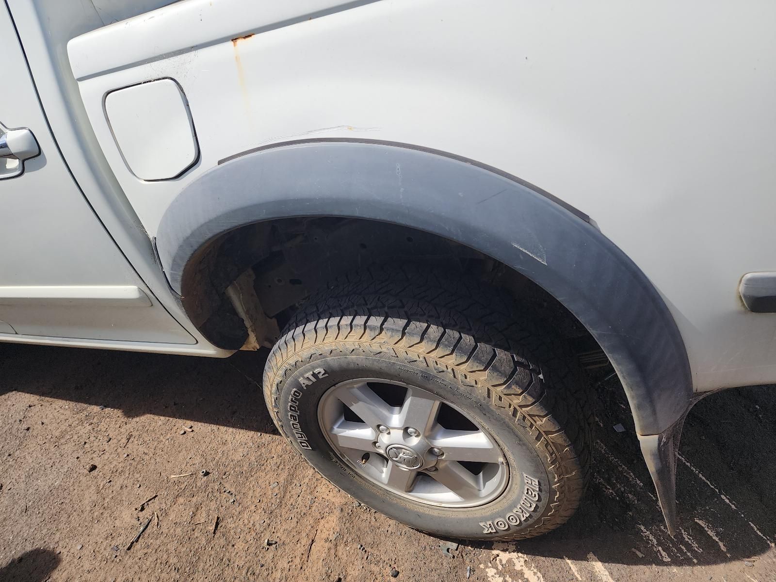 Close-up of a Silver SUV’s Rear Wheel — South West 4WD Wreckers In Harristown, QLD