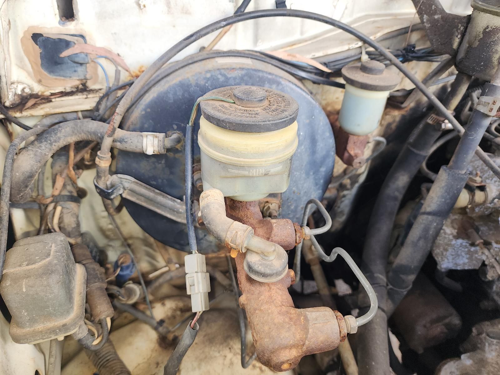 Close-up of a Dusty Car Engine Compartment With Hoses — South West 4WD Wreckers In Harristown, QLD