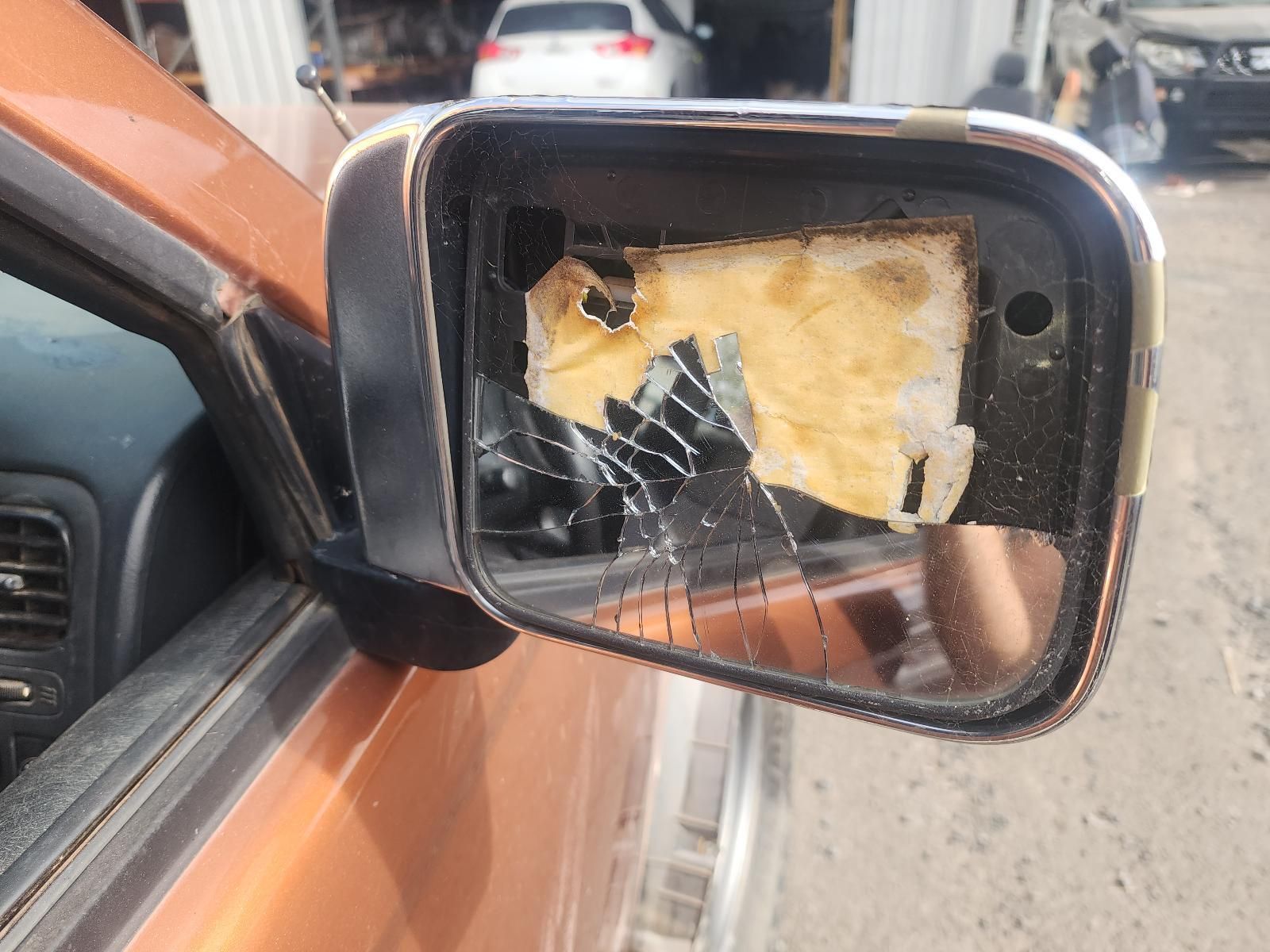 Broken Car Side Mirror Taped — South West 4WD Wreckers In Harristown, QLD