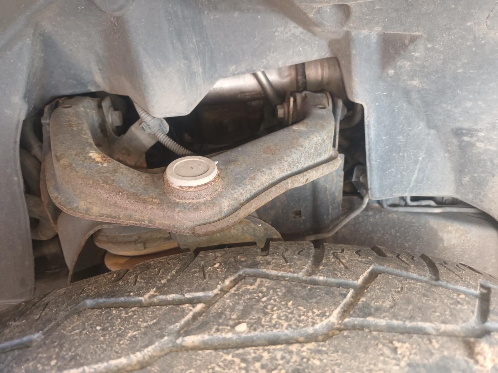 Close-Up of A Car Suspension and Wheel Well Behind a Tyre Tread — South West 4WD Wreckers In Harristown, QLD