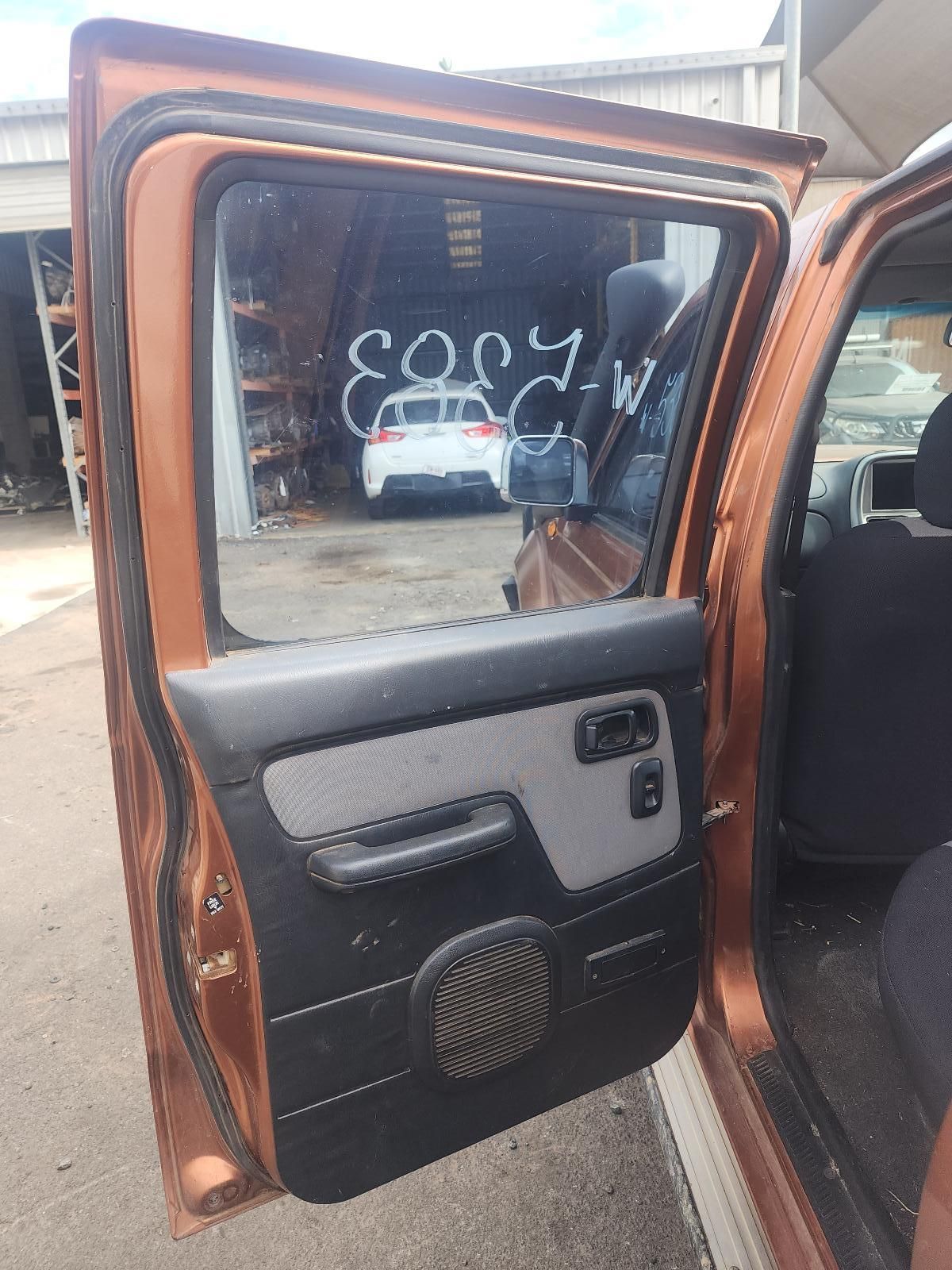 Open Car Door With Black and Gray Panel — South West 4WD Wreckers In Harristown, QLD