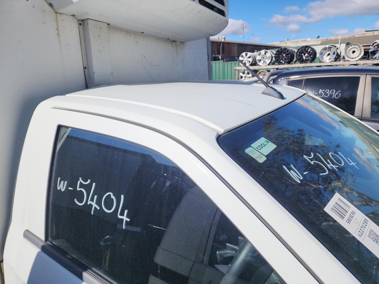 White Car Parked Beside a Wall — South West 4WD Wreckers In Harristown, QLD