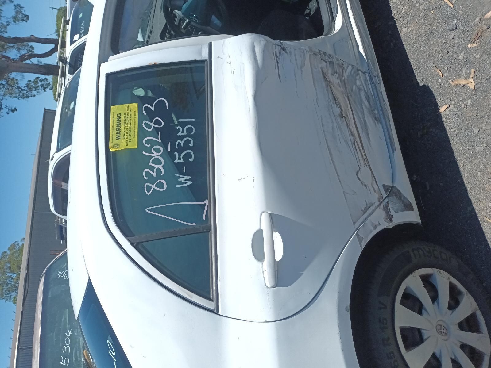 White Sedan Parked on A Street, with Sale Writing on The Rear Window — South West 4WD Wreckers In Harristown, QLD