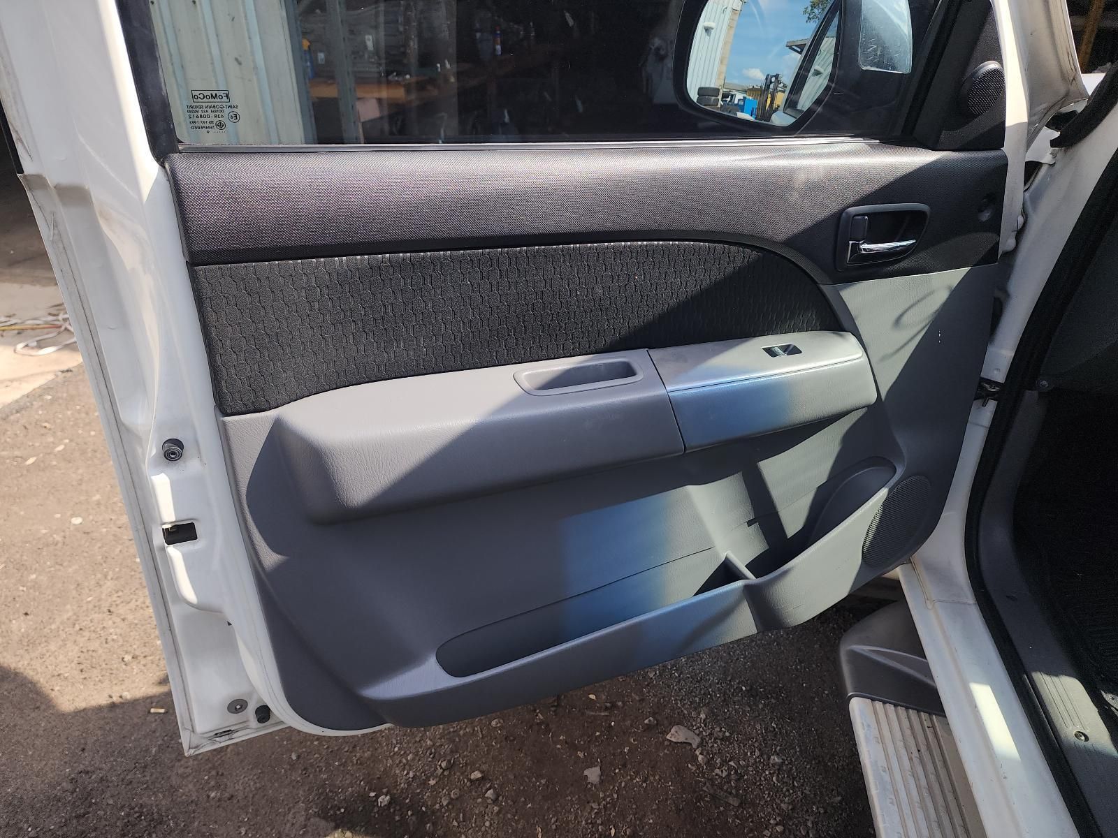 Open Car Door With Gray Interior Panel — South West 4WD Wreckers In Harristown, QLD